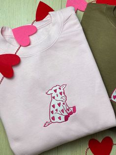 Pink valentines cow embroidery design! Available on a pink or brown Crewneck! Cute Cow Design, Valentines Crewneck Sweatshirt, Taylor Embroidery, Valentine Crewneck, Cow Embroidery Design, Valentine’s Day Embroidery Sweatshirts, Valentines Cow, Cow Embroidery, Cute Crew Neck Sweatshirt For Valentine's Day