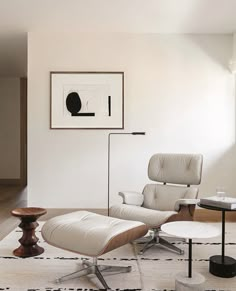 an eames chair and ottoman in the living room