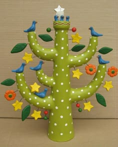 a green cactus with birds and stars on it