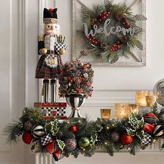 a christmas mantel decorated with ornaments and wreaths