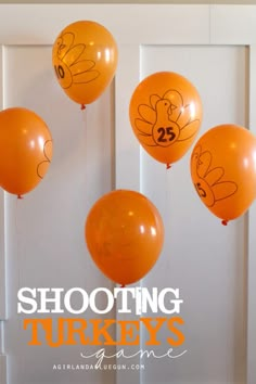 orange balloons with cartoon turkeys on them