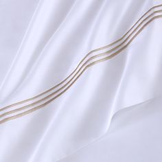 a white sheet with gold lines on it