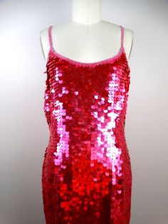 "This is another sparkly sequined party dress! It's fully embellished with bright pink paillette sequins. It's in excellent condition! Bust - 34\" Waist - 26\" Hips - 38\" Length - 37\" This dress comes from a pet-free and smoke-free home. If you would like more info or have any questions, please don't hesitate to ask!" Pink Sequin Fabric For Night Out And Holiday, Pink Sequin Fabric For Holiday And Night Out, Holiday Disco Sequin Dress With Contrast Sequins, Holiday Disco Style Sequin Dress With Contrast Sequins, Party Season Disco Embellished Sequin Dress, Disco Embellished Sequin Dress For Party Season, Disco-style Embellished Sequin Dress For Party Season, Pink Sequin Dress For Holiday Party, Disco Style Embellished Sequin Dress For Party Season