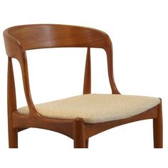 a wooden chair with a beige seat cushion