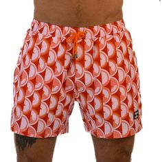 Step back in time to the 70s with East x East Island Fever men's shorts. Featuring a bold orange colorway and a retro-inspired design, these shorts are the perfect addition to any fashion-forward individual's summer wardrobe. Made with premium sustainable materials, these shorts not only look great but are eco-friendly too. The elasticated waist and drawstring adjustment ensure a comfortable and secure fit, making them perfect for any summer activity, from beach days to pool parties. With their