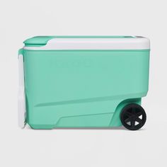 an ice chest with wheels on the front and side, in mint green / white