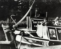 an old black and white photo of a boat in the water