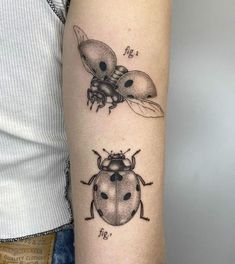 a ladybug tattoo on the left arm and an antelope tattoo on the right arm