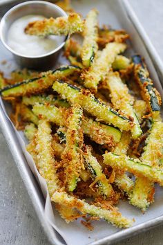 fried zucchini fries on a tray with ranch dressing