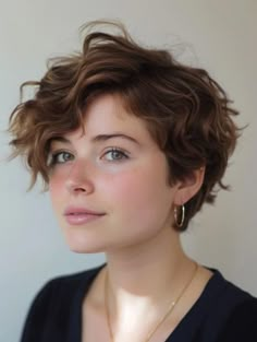 2024 Pixie Cut Trends for Wavy Hair: Chic and Effortless Styles Wavy Asymmetrical Pixie, French Hair Short, Pixie Cut For Thick Wavy Hair, Short Haircuts For Fine Wavy Hair, Permed Pixie Cut, Wavy Hair Pixie Cut, Pixie Haircut Wavy Hair