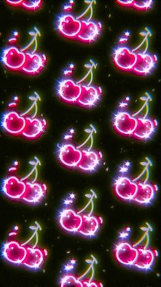 an array of neon lights with cherries on them