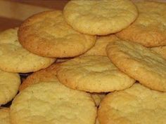 a pile of cookies sitting on top of a wooden table