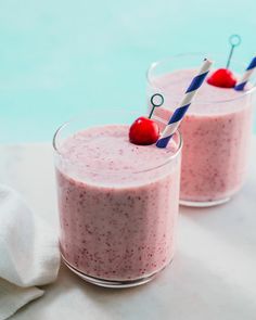 two glasses filled with smoothie next to each other