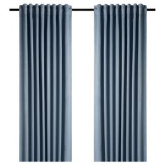 a pair of blue curtains hanging on a curtain rod