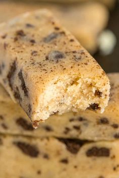 a close up view of some cookies with chocolate chips on top and one cookie chip in the middle