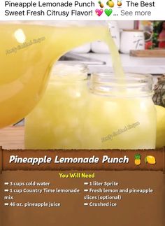 the pineapple lemonade punch is being poured into a mason jar