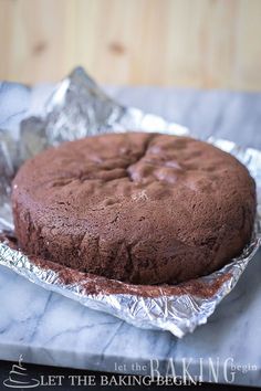 a chocolate cake sitting on top of aluminum foil