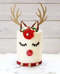 a cake decorated with reindeer antlers and flowers