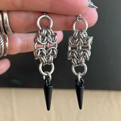 Handmade Maille & Black Spikes Dangly Earrings . Earrings Posts Are Stainless Steel . To Create The Maille Links I Use Stainless Steel Hoops As Well And Black Spikes Charms Also Stainless Steel . It Is Nickel Free , Allergy Free , Hypoallergenic , No Itching , Do Not Change Color , Rust Or Turn Skin Green . Handmade By Me Any Questions Lmk ! Handcrafted / Boho / Bohemian / Boho Chic / Gypsie / Hippie / Festival / Goth / Gothic / Viking / Medieval / Victorian / Rock & Roll / Rocker / Rock Chic / Gothic Beaded Earrings, Techno Jewelry, Gothic Viking, Chain Mail Earrings, Chainmaille Jewelry Patterns, Gothic Jewelry Diy, Chainmail Earrings, Viking Medieval, Chainmaille Earrings