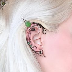 Welcome to our magical realm of jewelry! These captivating elf ears earrings are meticulously handcrafted with love and attention to detail. Crafted from black wire and adorned with enchanting green Czech glass, they bring a touch of whimsy and fantasy to your style. The intricate design features delicate bird figures perched on the ear cuffs, adding an extra element of charm and grace. Each earring is carefully shaped to resemble the elegant pointed ears of elven beings, lending an ethereal and otherworldly aura to your look. These earrings are not only a beautiful fashion accessory but also a perfect complement to cosplay costumes, Renaissance fairs, or themed events. Embrace your inner elf, fairy, or magical creature with these unique and stunning pieces. Wear these elf ears earrings wi Elf Ears Earrings, Fae Ears, Elven Ears, Elf Fairy, Ear Art, Elven Jewelry, Pointed Ears, Black Birds, Fantasy Gifts