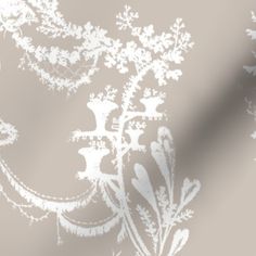 an image of a wallpaper with white flowers on grey and beige background, which is very similar to the pattern in this photo