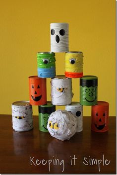 a stack of toilet paper rolls with faces on them and the words keep it simple