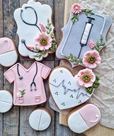 decorated cookies are arranged in the shape of medical instruments and nurse's scrubs