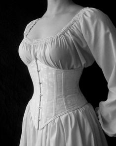 "Our c. 1900 Lilly corset recreates the under-bust corset shape popular from the 1870s to the turn of the 20th century. It defines a lovely curved waist with boning on the seams without affecting the natural shape of the bust. There is a center front busk opening and a graceful point at the top and bottom edges in both the front and the back. Available in size Small-2XL or custom sized up to 4XL Size chart available here or select \"custom\" for specific measurements: www.periodcorsets.com/sizin Corset Outfits, Under Bust Corset, Victorian Corset, Corset Outfit, Corset Pattern, Corset Fashion, Old Fashion Dresses, Underbust Corset, Corsets