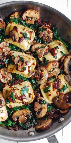 a close up view of mushrooms and spinach