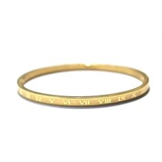 Stack this one with any of our gold bracelet options for a high end look. It is a stainless steel setting with a tight hinged closure. Fit: One size. Mini Gold, Roman Numeral, Roman Numerals, Bangle Bracelets, Gold Bracelet, Bangles, Stainless Steel, Bracelet, Gold