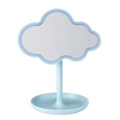 a cloud shaped mirror on a stand with a light blue base and white top, against a white background