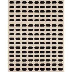 a black and white rug with small squares on the bottom, in various sizes and colors