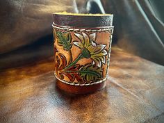 a close up of a leather cup on a table