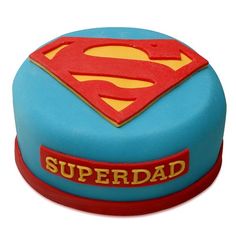 there is a superman cake on the table