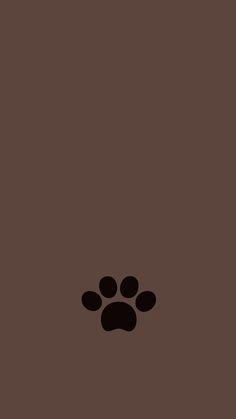 an animal paw print on a brown background