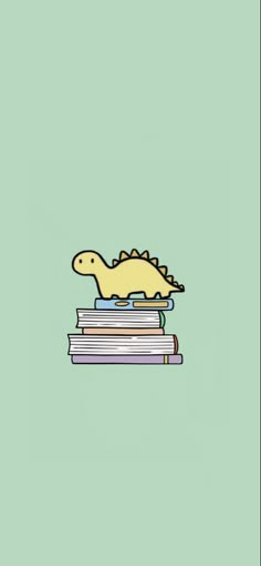 a dinosaur is sitting on top of some books and has his head resting on the stack of books