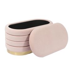 six pink coasters with gold rims and black velvet inner one on each side