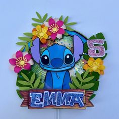 an image of a birthday cake topper with the name eemba on it