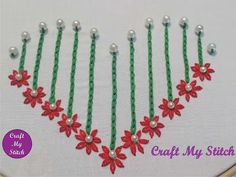 a red and green beaded necklace with flowers on it