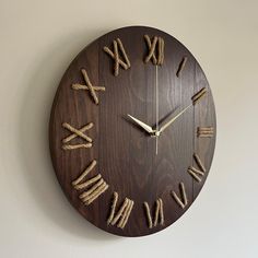 a clock made out of rope with roman numerals