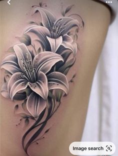 a woman's thigh with white flowers on it and the words image search below