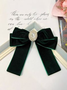 "Emerald Green velvet tail bow with rhinestone center. Size:  Bow measures approximately 5\" tail 4\"attached to a alligator clip or French Barrette.  All hair bows are heat sealed to prevent fraying.  All items are handmade using high quality materials. DISCLAIMER Colors may vary slightly from pictured due to your resolution and settings on PC or Phone. No two or more bows are identical due to the colors and prints of fabric. SAFETY: All Bows are not toys and should be handled with care. They m Emerald Green Hair, Dark Green Hair, Emerald Green Velvet, Ireland Wedding, Headband Jewelry, Blue Room, Neck Bow, Green Bows, French Barrette