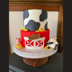 there is a cake that looks like a farm scene