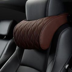 the interior of a car with black leather and brown stitching on the armrests