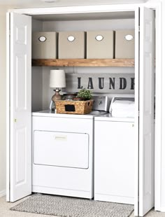 a washer and dryer sitting in a room next to an open closet door