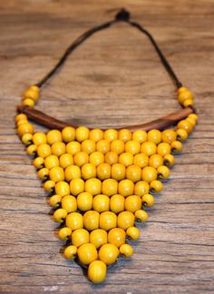 Baby Bunting Necklace in Yellow $20 Bohemian Yellow Handmade Necklace, Bohemian Yellow Round Beads Choker, Handmade Yellow Bohemian Bib Necklace, Artisan Yellow Beaded Necklace, Yellow Bohemian Hand-strung Necklaces, Baby Bunting, Bones, Etsy Store