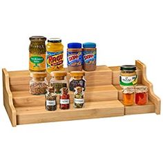 a wooden tray with spices and condiments on it