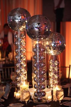 disco ball centerpieces with candles and place settings