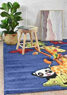 a child's room with a blue rug and wooden stools, potted plant and pictures on the wall