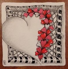 a drawing of a white heart with red flowers in the center on a brown surface